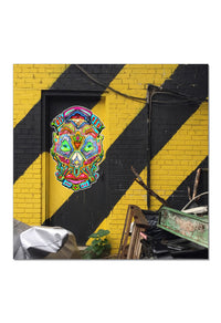 Colorful futuristic captain on a yellow and black striped wall in NYC.