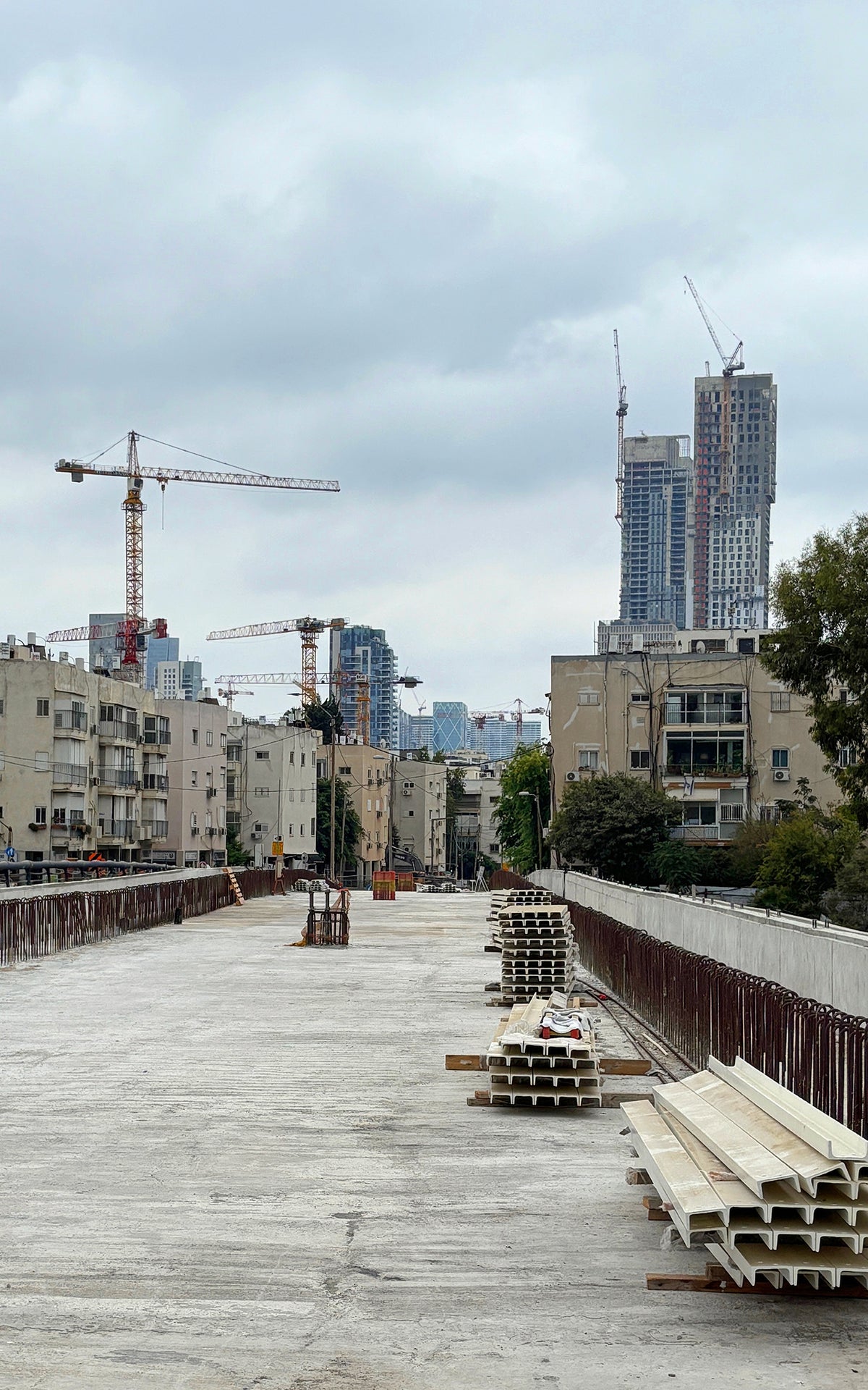 Photography Art Print showing new bridge Construction at TLVs Ibn Gabirol city entrance with cranes against a city skyline 