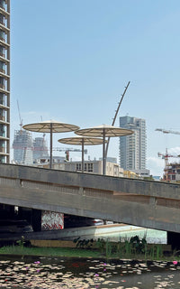 Photography print with a look from city hall of TLV to tall buildings under construction and cranes over sky in the background